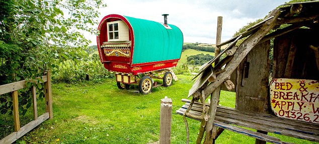 Romantic bolthole: Jonathan Melville-Smith refurbished an idyllic gypsy caravan in Cornwall (see below)