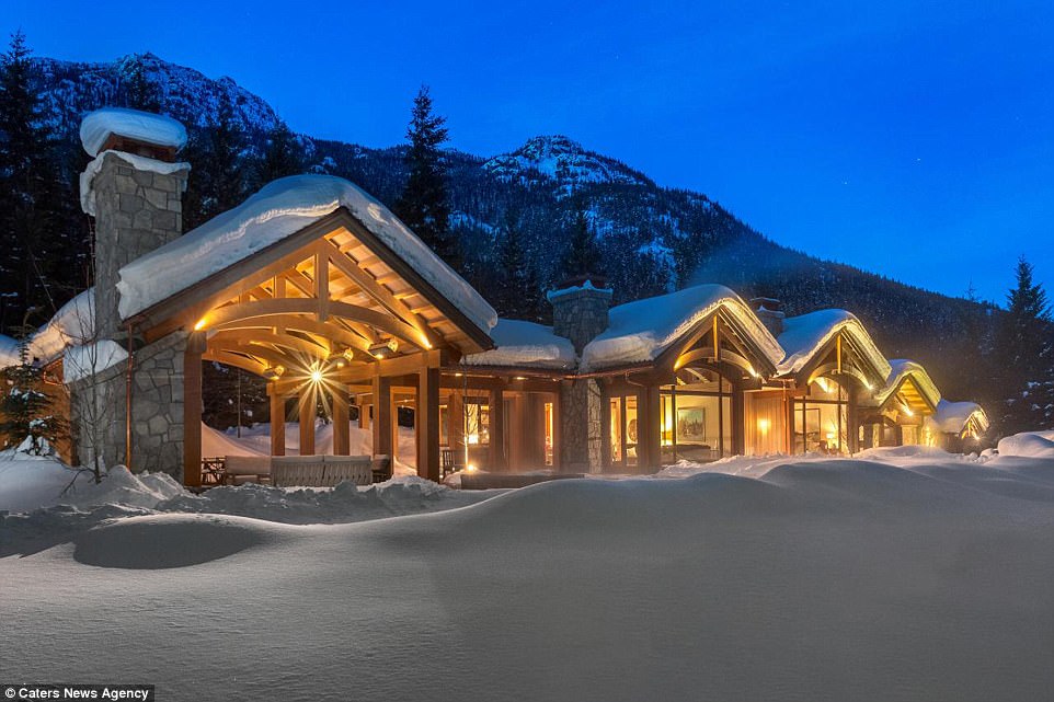 The exterior of the home which is settled among the mountains has a log cabin appearance giving it a fairy tale finish