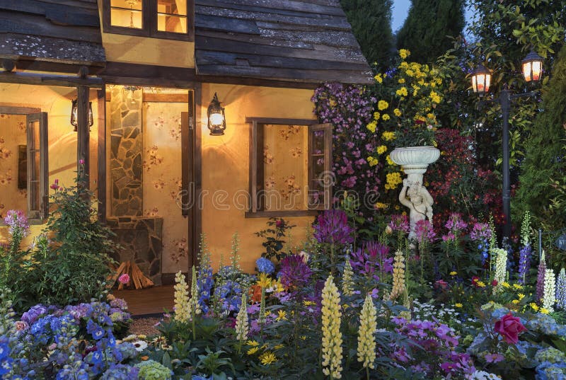 Backyard flower garden. Landscaped backyard of house with flower garden royalty free stock photography