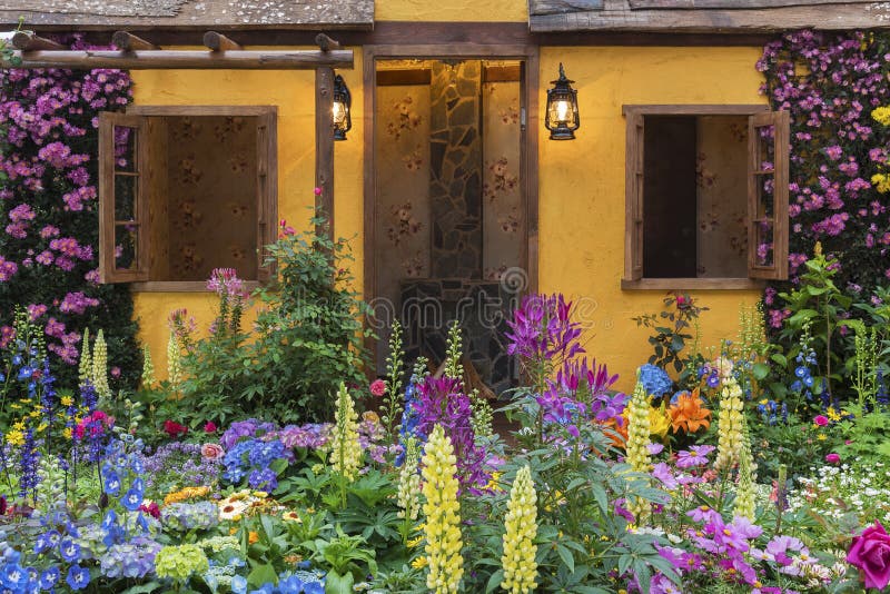 Backyard flower garden of residential house. Landscaped backyard of house with flower garden royalty free stock photo