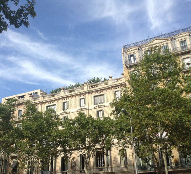 Hello from the terrace. Barcelona, a beautiful french style building with a gracious garden on the terrace in the boulevard Passeig de Gracia royalty free stock photos