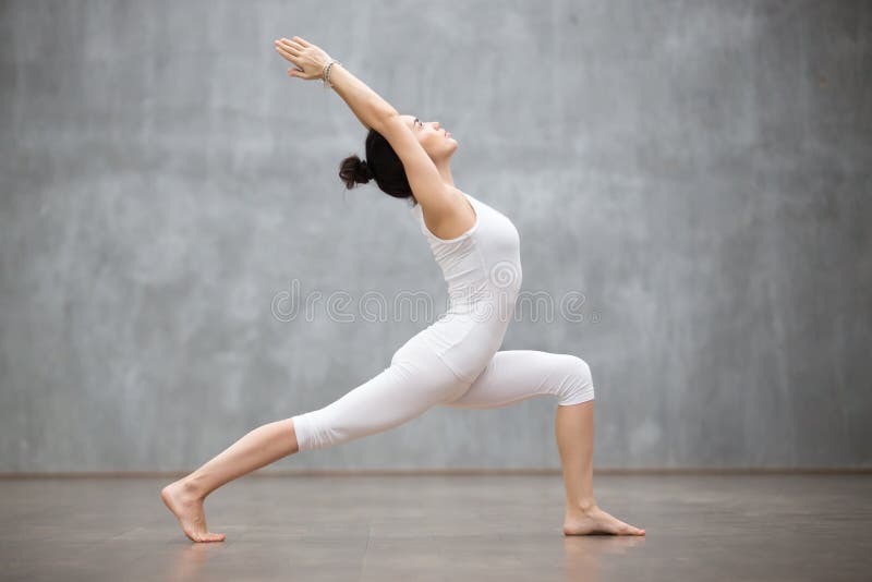 Beautiful Yoga: Warrior one pose royalty free stock image