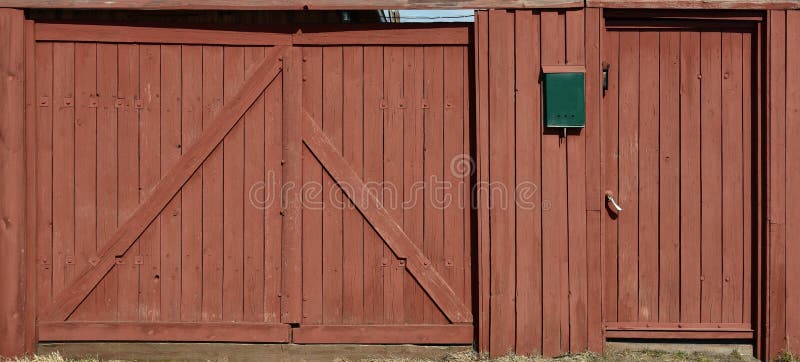 Brown wooden gate and gate in a private courtyard. Painted boards.  stock photography