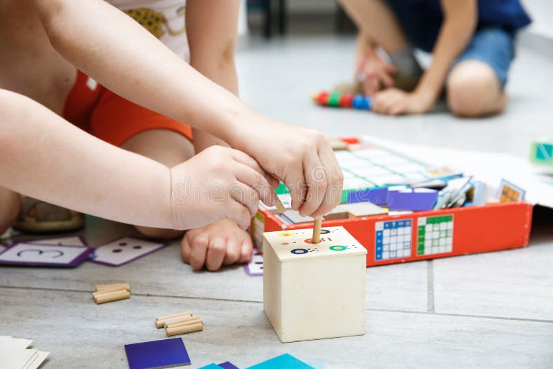 Children playing with homemade educational toys royalty free stock photos