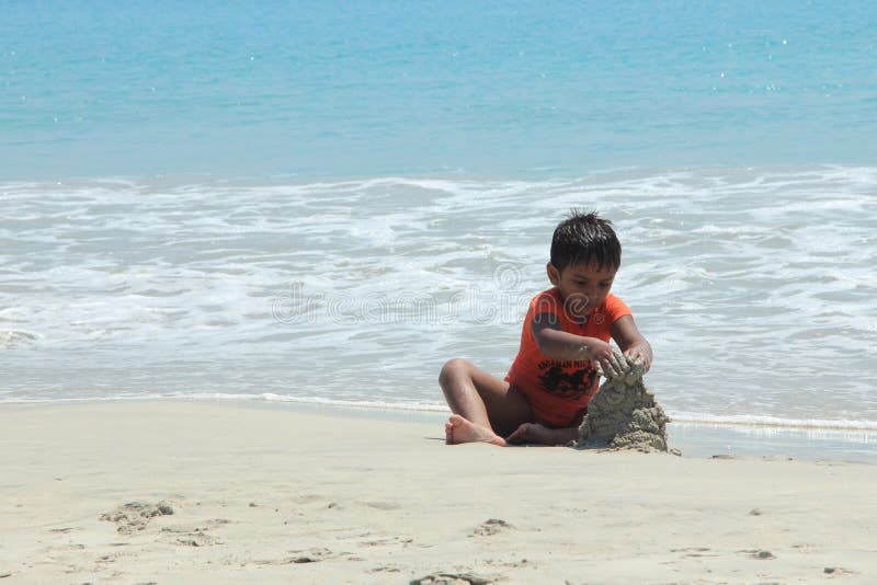 Children playing in Radha Krishna beach royalty free stock images