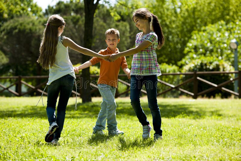 Children playing ring-around-the-rosy royalty free stock images