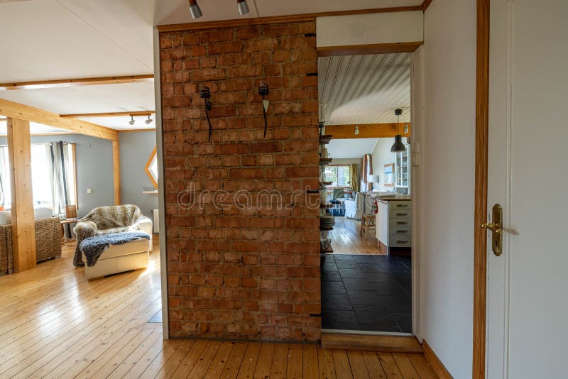 Close up interior view of large room with brick wall and kitchen of a private house stock images