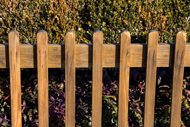 Close up of a part of decorative colorful wooden fence stock photo