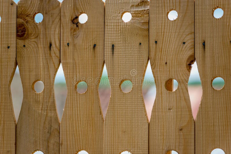 Close-up photography of a decorative wooden fence. stock photo