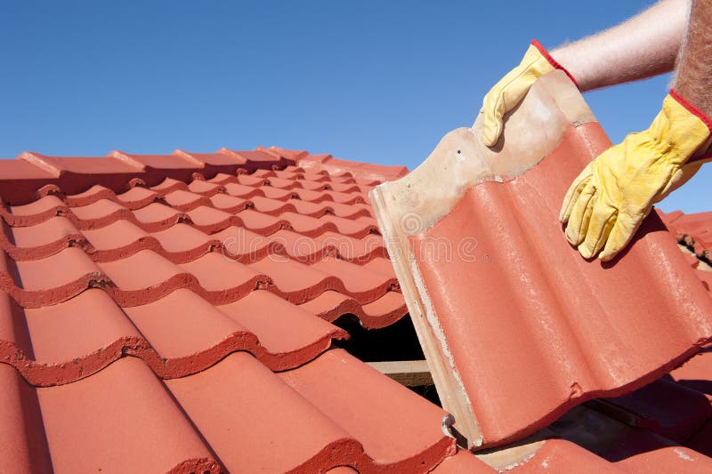 Construction worker tile roofing repair house stock photos