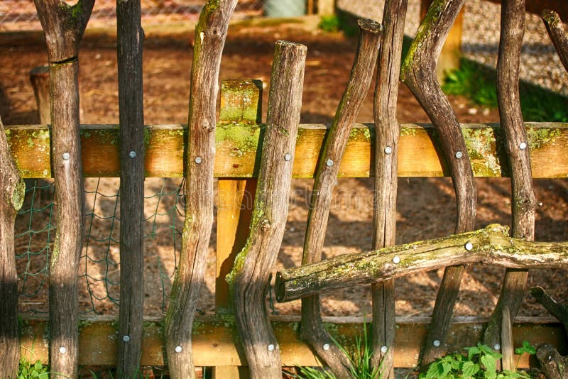 Decorative wooden fence from boards of various shapes. stock photography