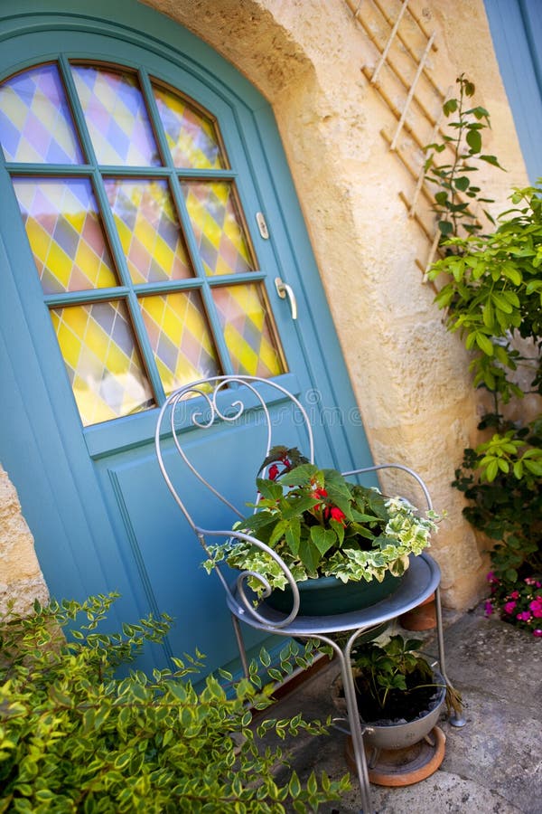 Garden on a terrace. Plants and flowers on the terrace of a charming house in a French village stock photo