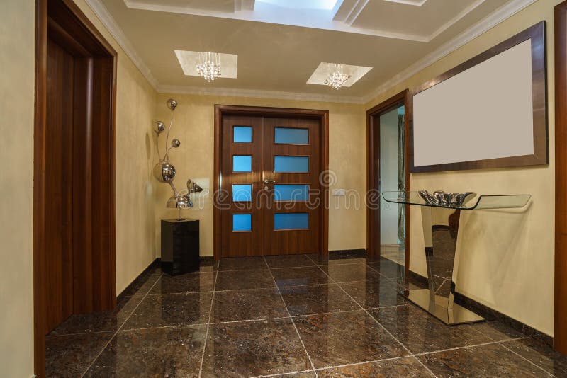 Hall and front door in a private villa stock images