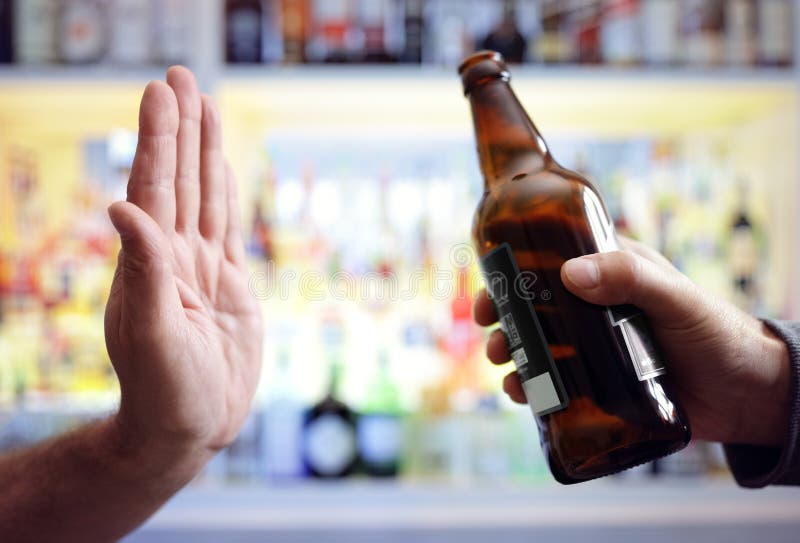 Hand rejecting alcoholic beer beverage royalty free stock photo