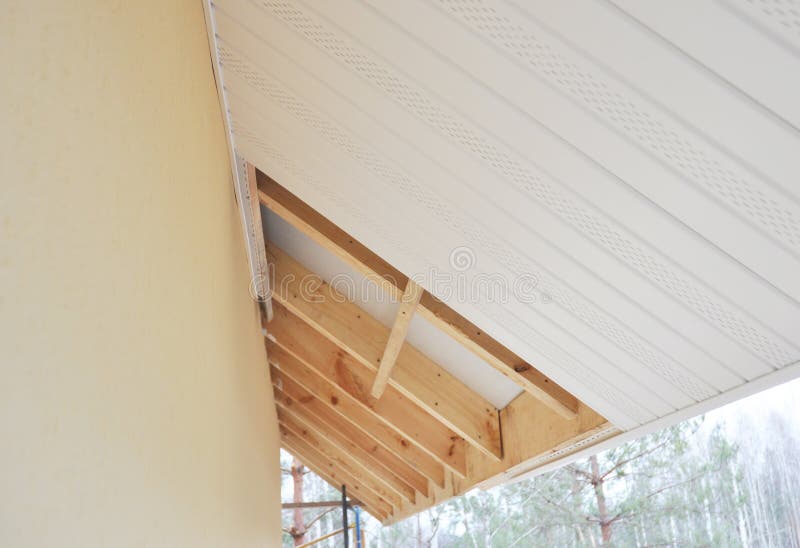 Installing roof soffits and fascia boards. Installing house soffit and fascia boards stock photos