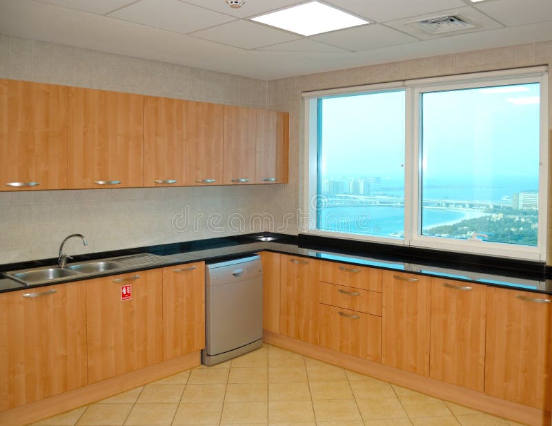 Kitchen in the apartment of luxury hotel. With a view on Palm Jumeirah man-made island, Dubai, United Arab Emirates royalty free stock images