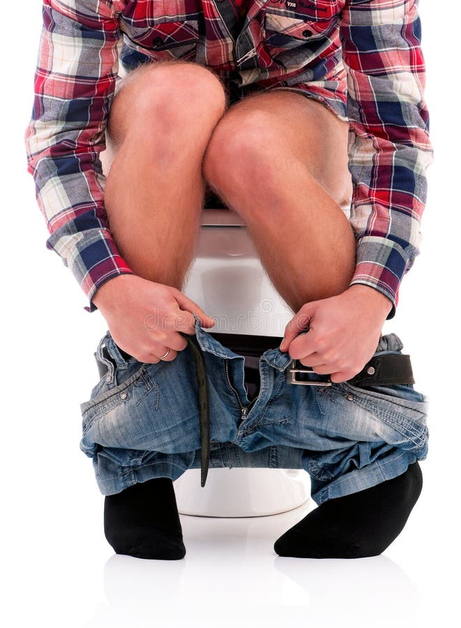 Man on toilet bowl. Man is sitting on the toilet bowl, on white background stock photo