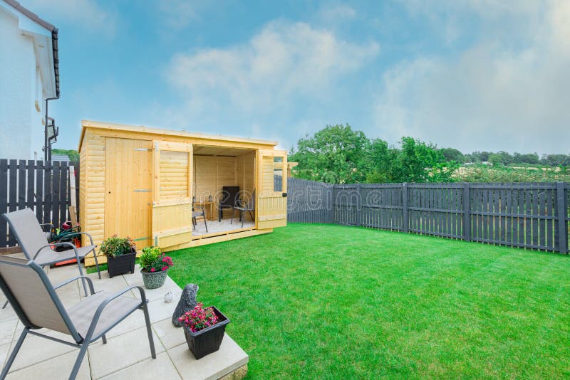 Modern Garden Designed and landscaped with newly Constructed Materials Including New Summer House Silver Copse painted Fencing and. A newly completed and stock photos