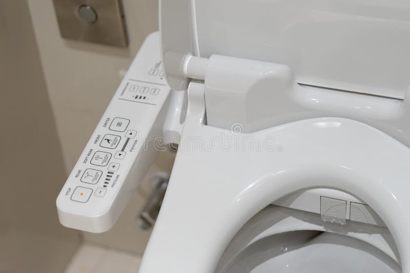 Modern high tech toilet with electronic bidet in Thailand. Indus. Try leaders recently agreed on signage standards for Japanese toilet bowls royalty free stock images