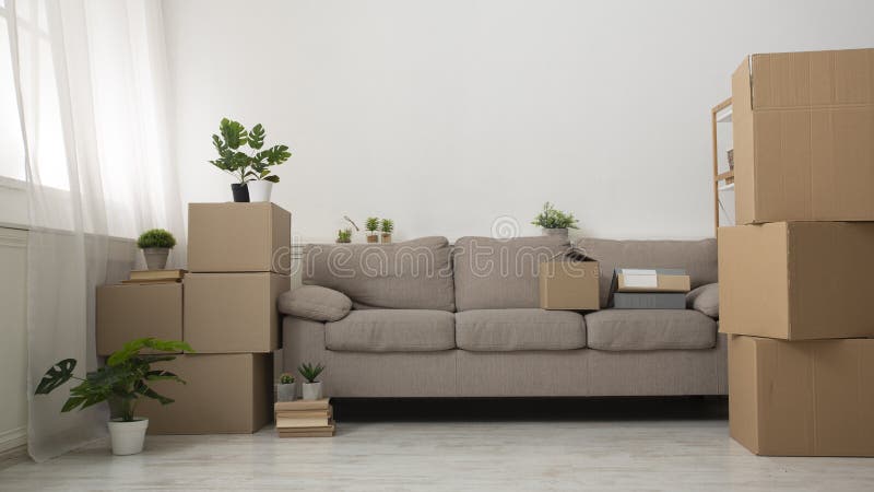 Modern living room with new repair and cardboard boxes royalty free stock image