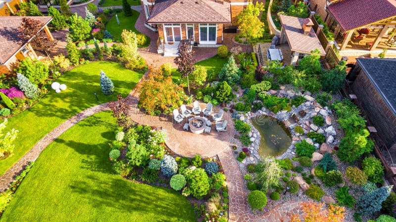 Landscape design with patio at residential house taken from above. Beautiful landscaping in home garden in summer. Moscow Region - Aug 24, 2019: Landscape design stock image