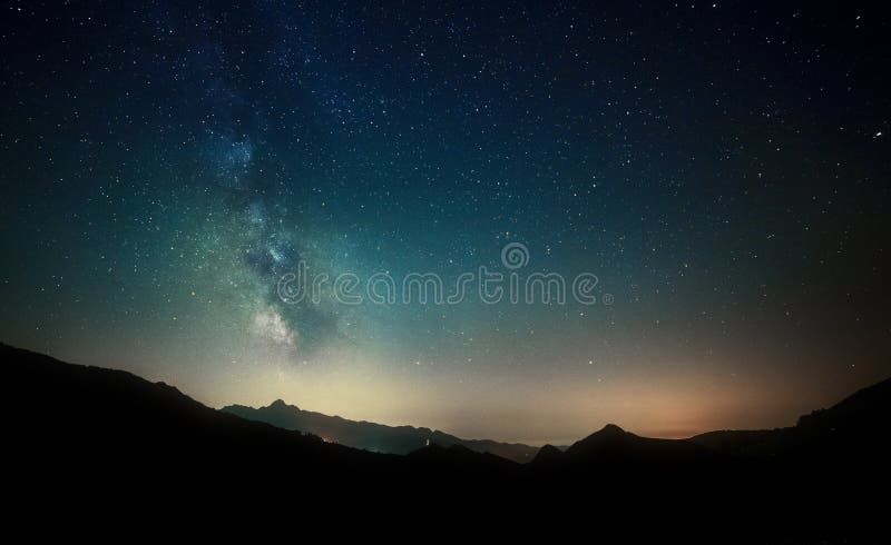 Night sky stars with milky way on mountain background royalty free stock photography