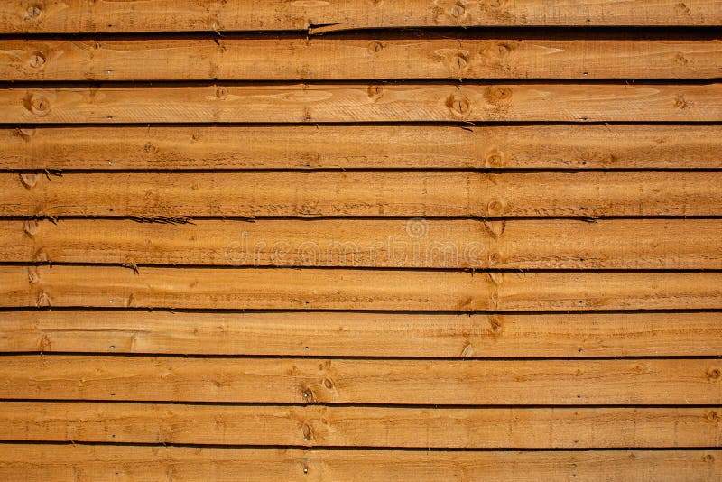 Orange colored fence made of wood royalty free stock photos