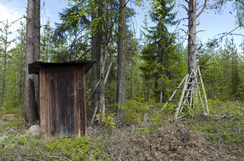 Outdoor toilet. Old wooden outdoor toilet from the North of Sweden stock images