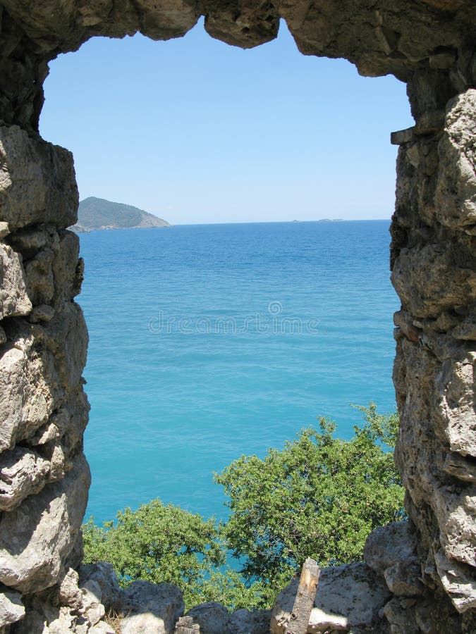 Panoramic view out of window in castle turkey. Panoramic view out of window in ancient castle olympos turkey royalty free stock photo