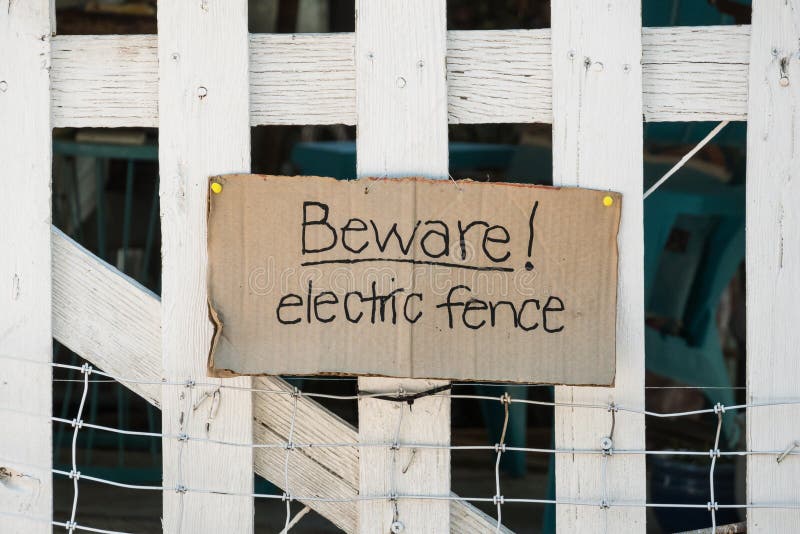 Picket fence made of wood is electrified royalty free stock image