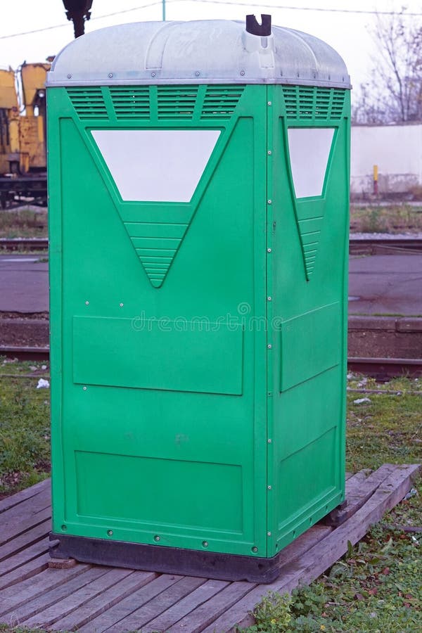 Portable toilet. Temporary portable green toilet cabin royalty free stock image