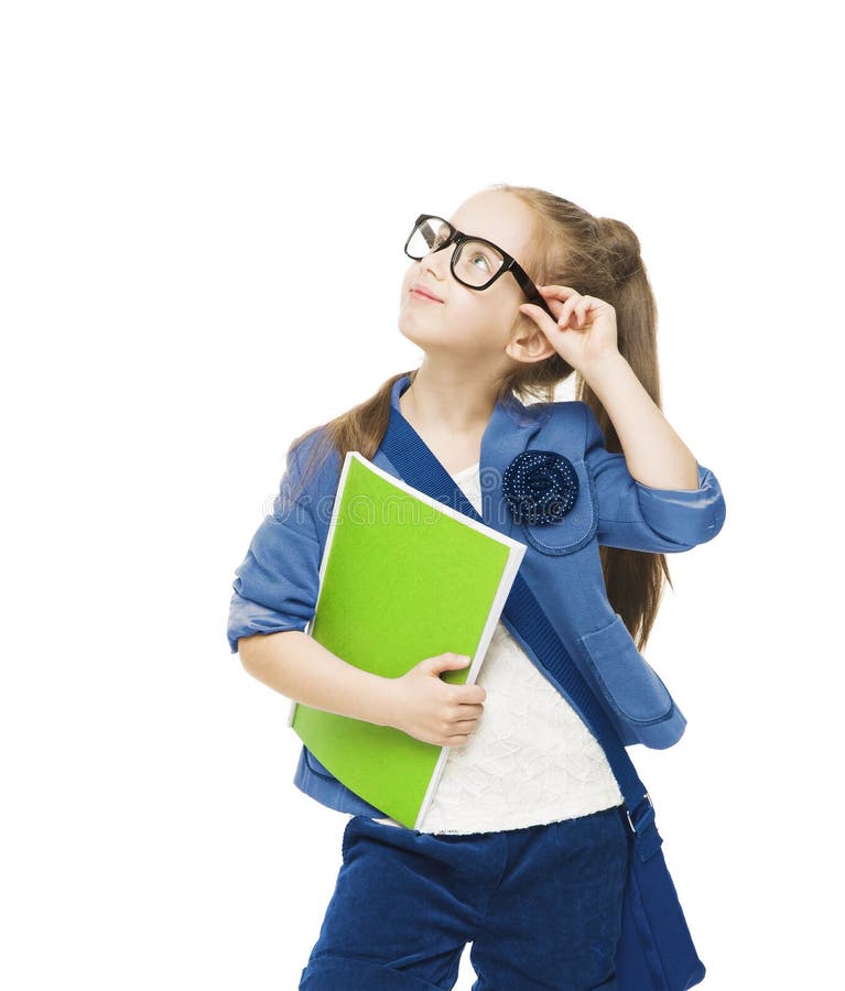 Schoolgirl child in glasses with books looking up. Student school girl isolated white background stock images
