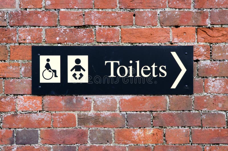 Sign showing disabled toilet and baby change room. Public sign showing disabled toilet and baby change room royalty free stock image