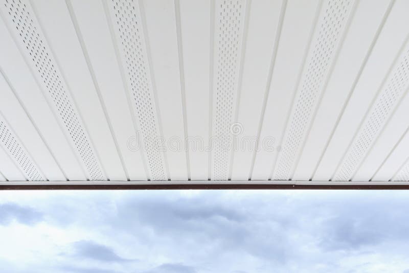 Soffit Board Installation. With clouds nature background stock photos