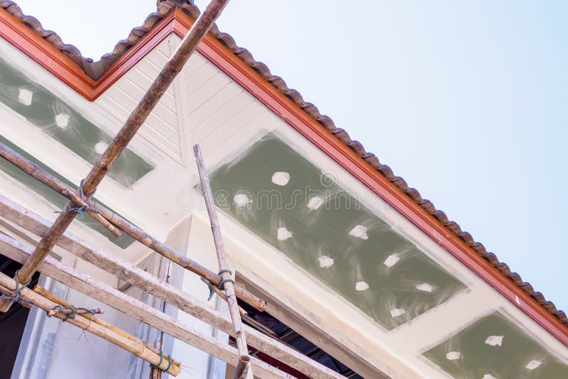 Soffit and Fascia Board Installation. At House Building Construction Site royalty free stock photo