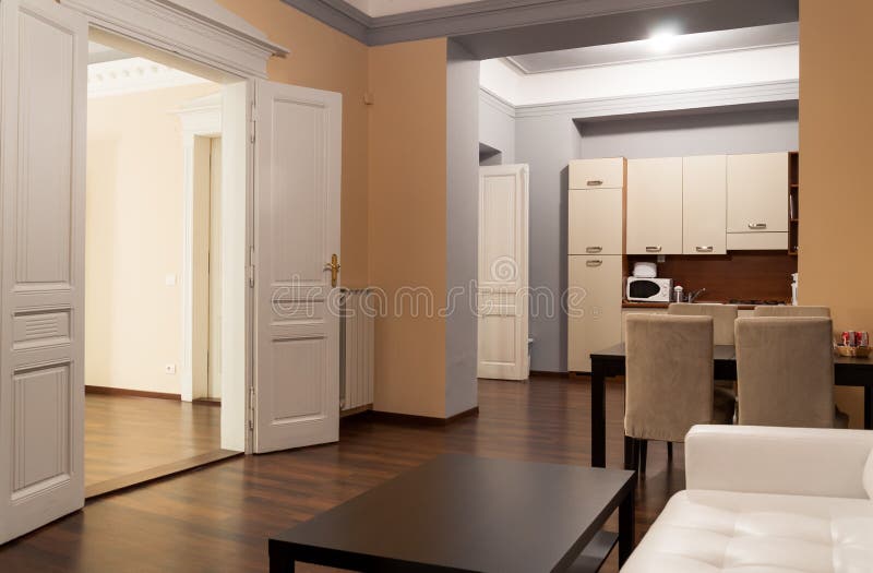 Spacious hotel apartment with kitchen. Classic spacious hotel apartment interior with kitchen, self-catering royalty free stock photos