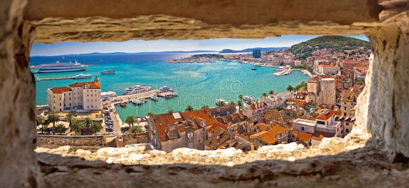 Split waterfront aerial panoramic view through stone window. Dalmatia region of Croatia royalty free stock photo
