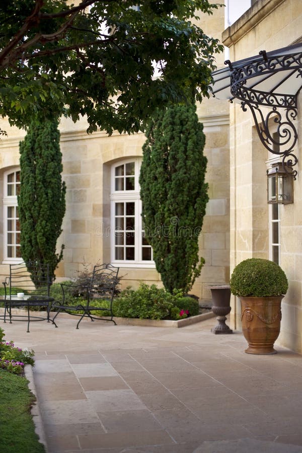 Terrace of a French mansion. Garden and furniture on the terrace of a French manion near Bordeaux stock photos