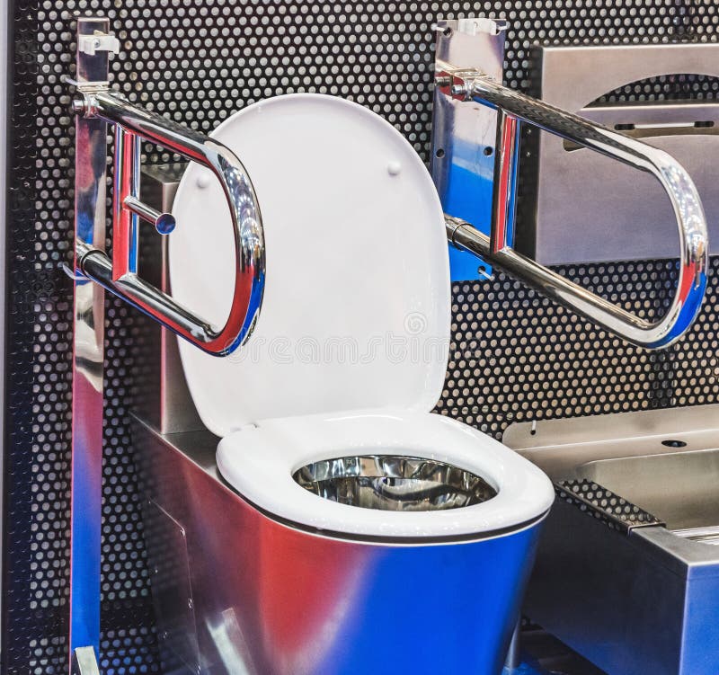 Toilet for disabled people with metal handrails for installation in vehicles, trains, buses and other.  royalty free stock photo