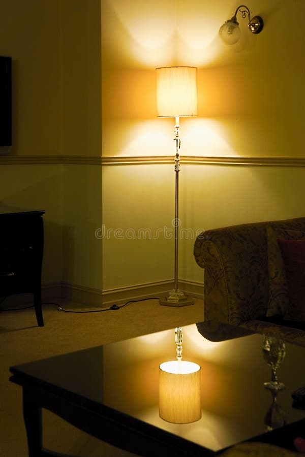 Warm homely room with lamp royalty free stock image