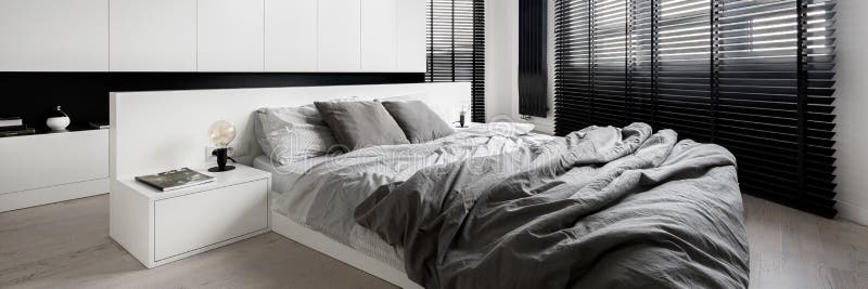 White bedroom with big windows, panorama stock image