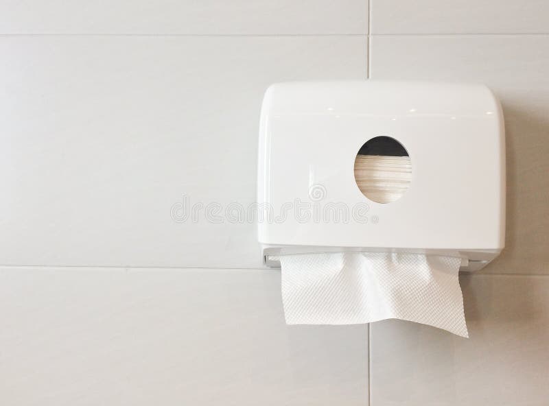White box of tissues on wall in toilet. White box of tissues on wall in toilet (restroom stock photos