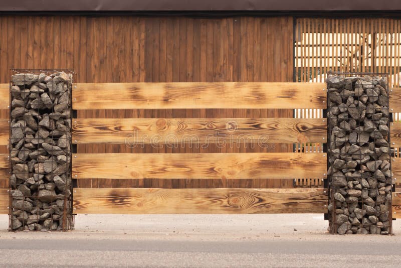Modern Fence Made From Metal Siding And Profile Sheet Like As Natural Wood Board royalty free stock photos