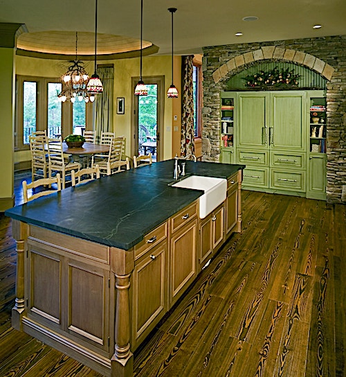 Gorgeous kitchen with a center island, breakfast nook, and abundant cabinets